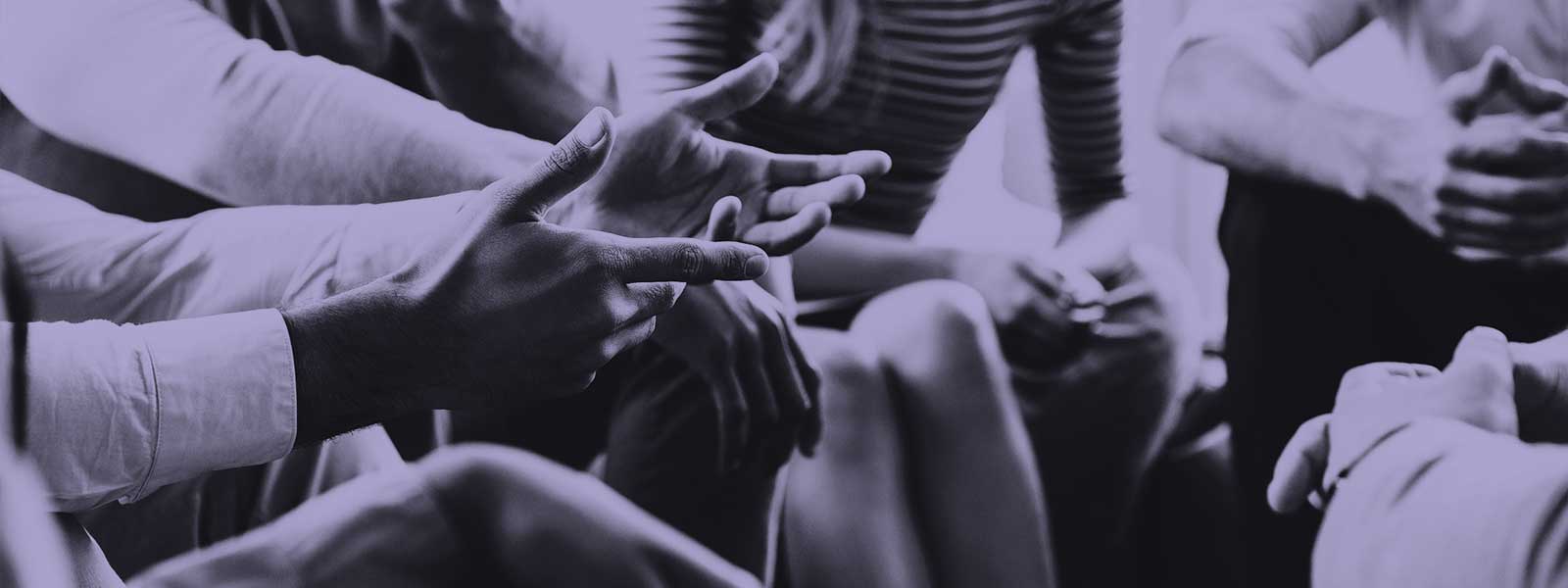 Close-up of group of people in discussion