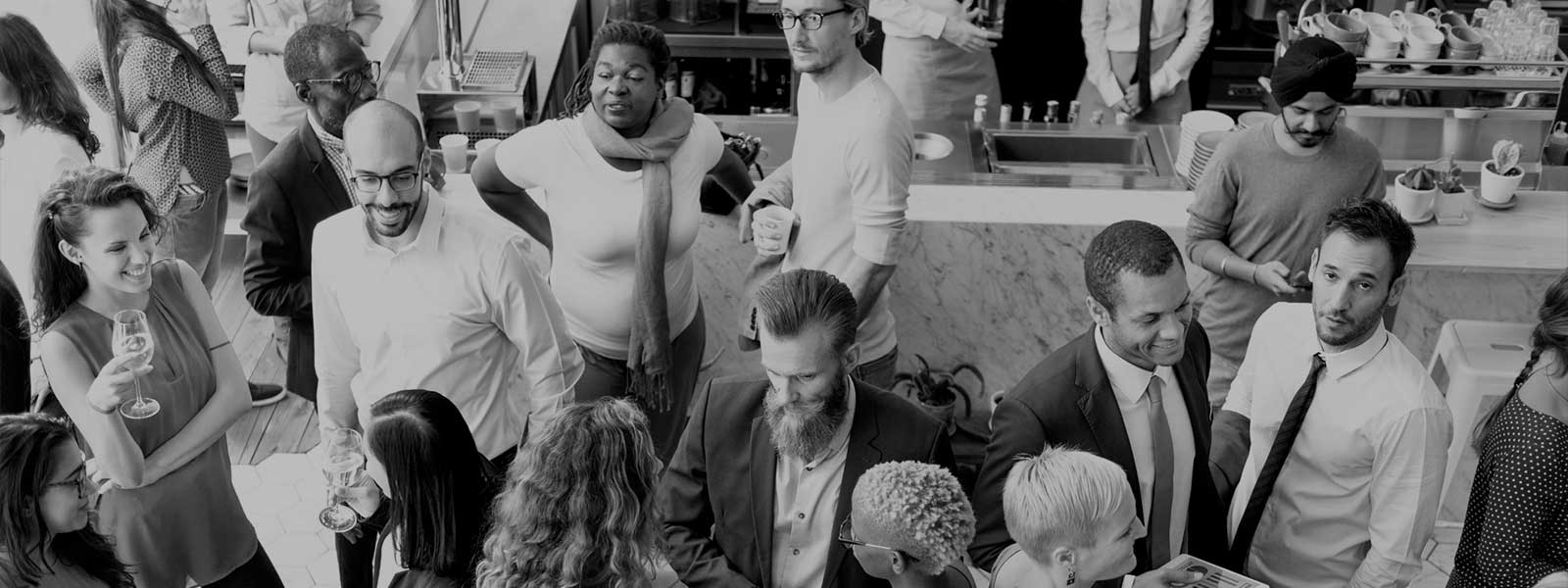 A large group of people networking at an event