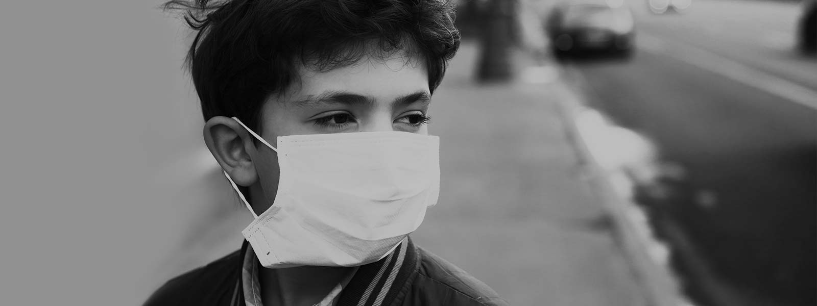 Boy wearing a surgical mask