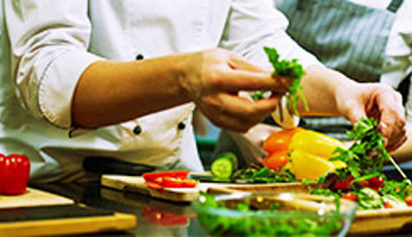 Person preparing vegetables in a kitchen