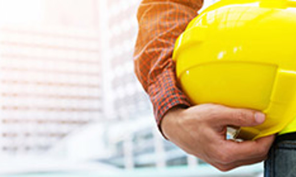 Person holding a hard hat