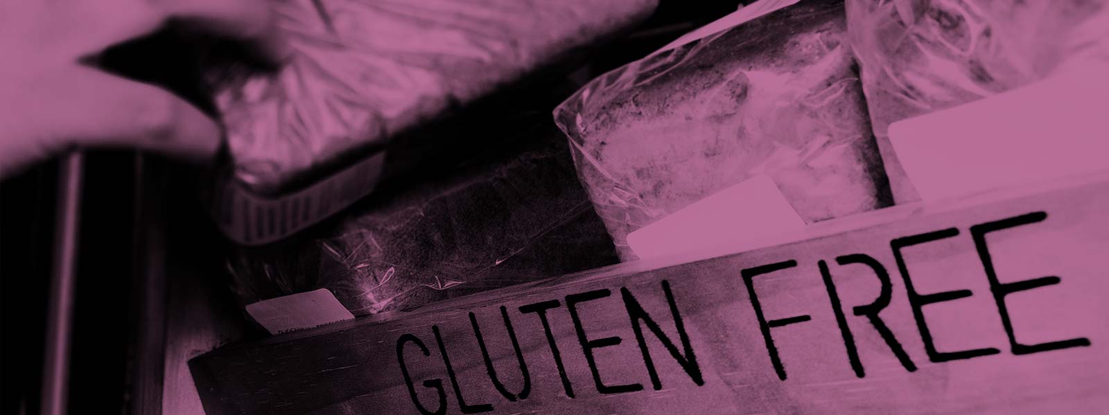 Bread on a shelf with a gluten free sign