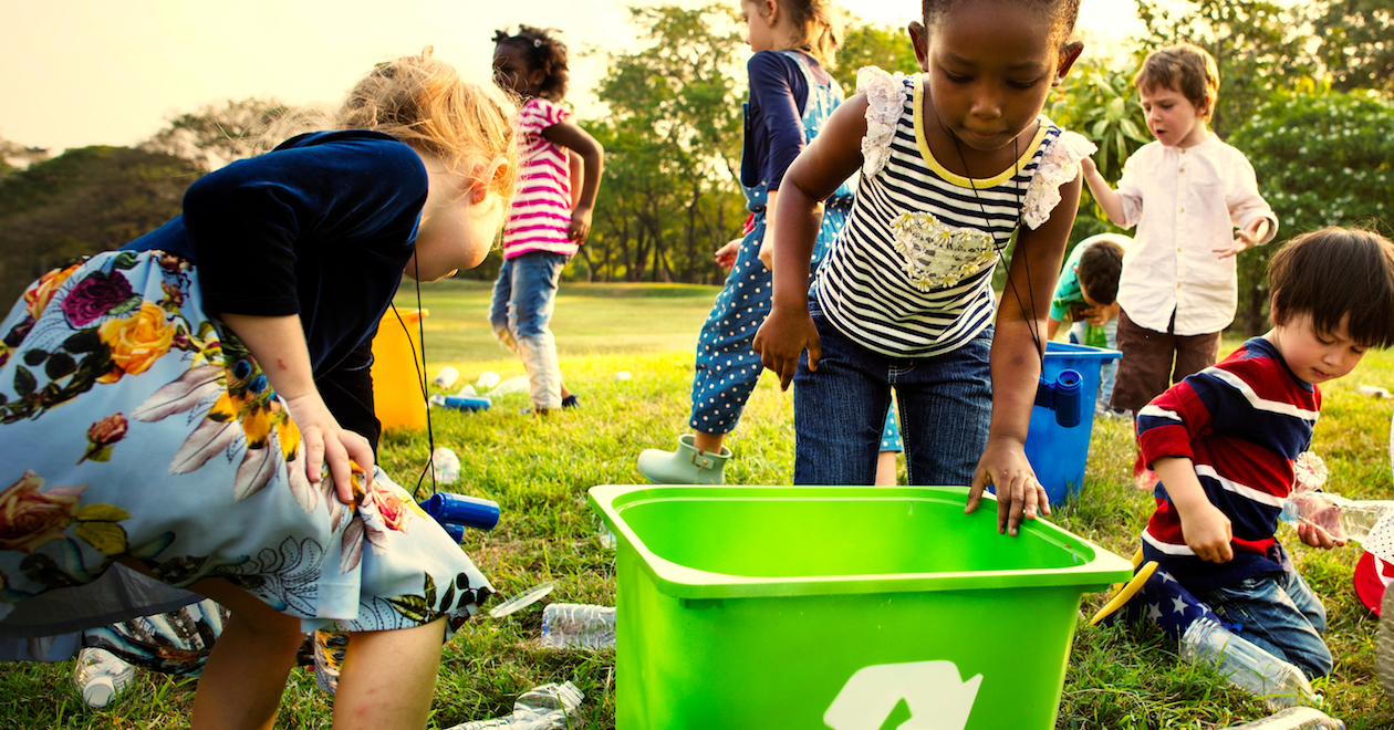 Children on a litter-pick outdoors.