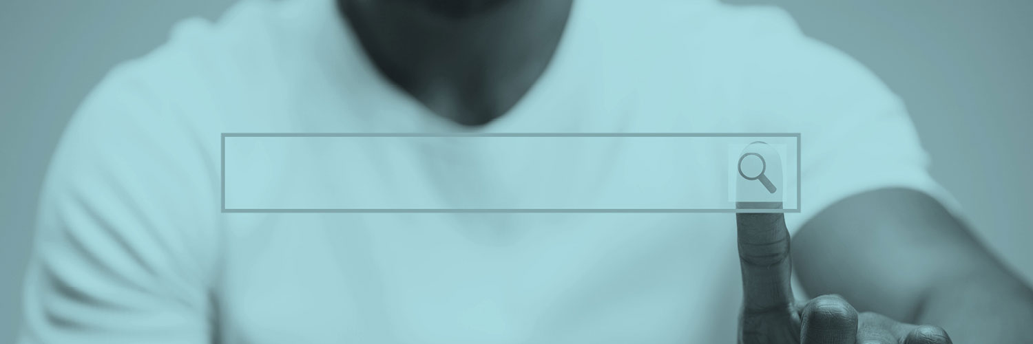 Person touching a search bar on a screen