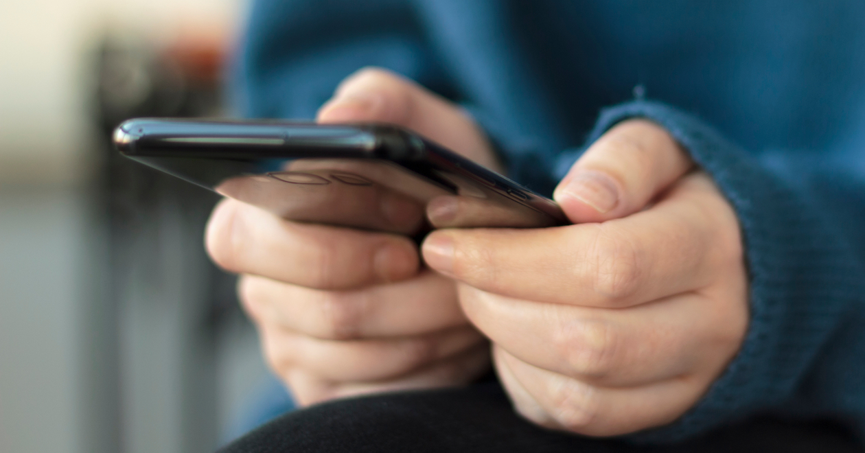 Close-up of woman's hands holding a smartphone