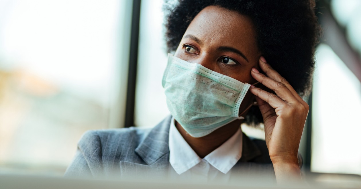 Businesswoman wearing a face mask while in the office