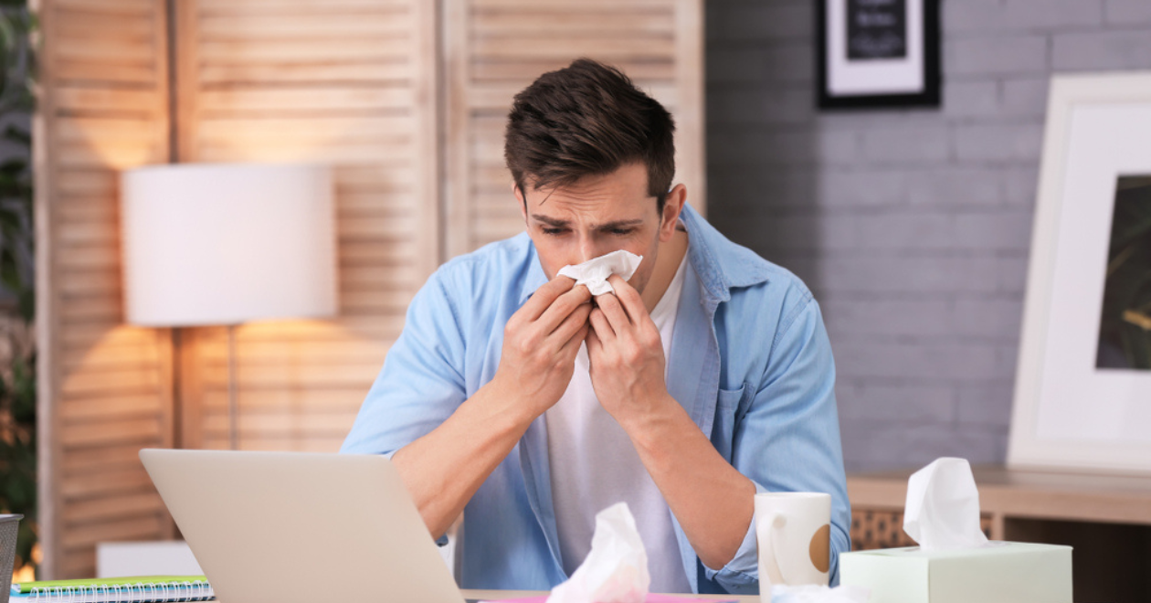 Office worker sick at desk